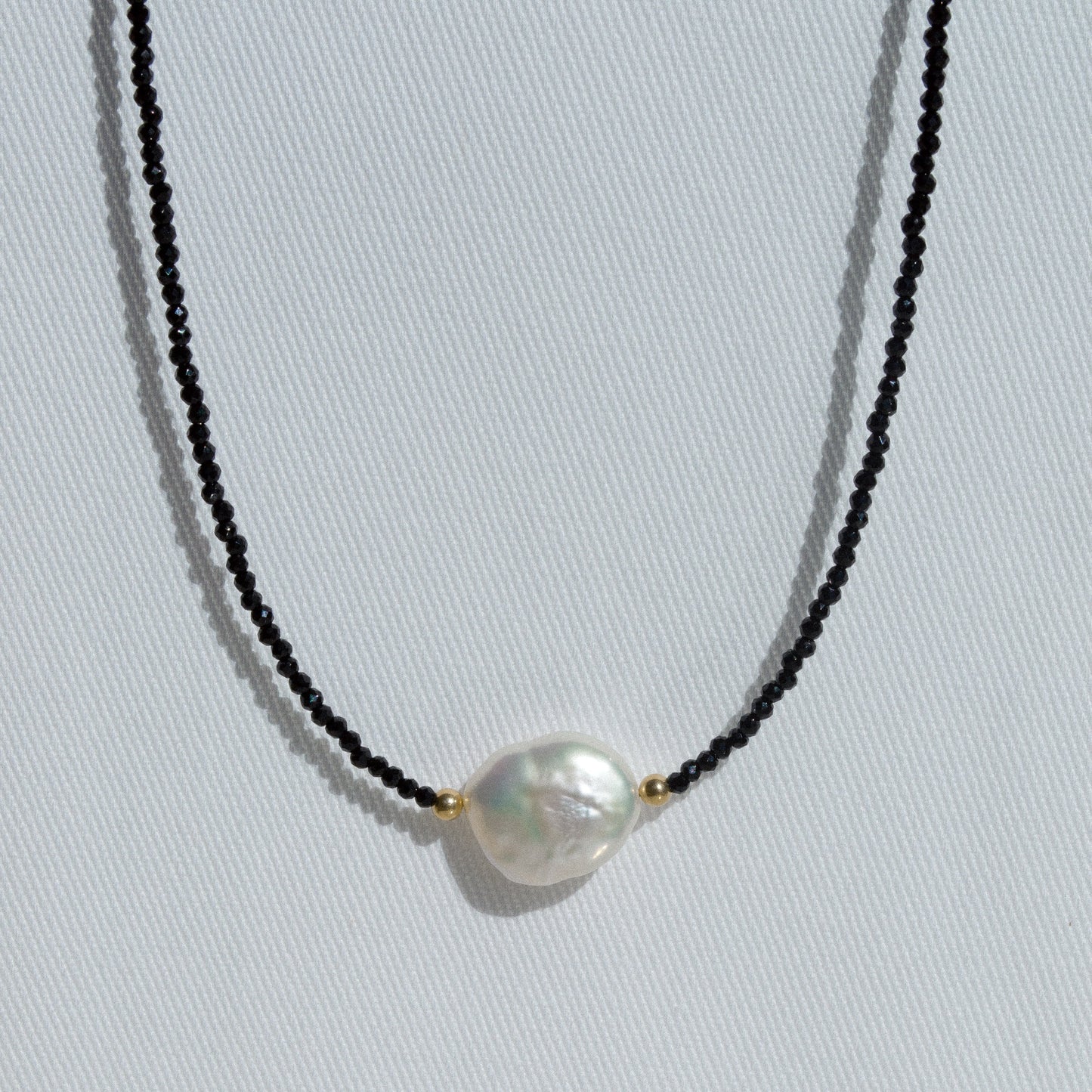 gold necklace with black spinel beads, baroque pearl and tiny gold balls