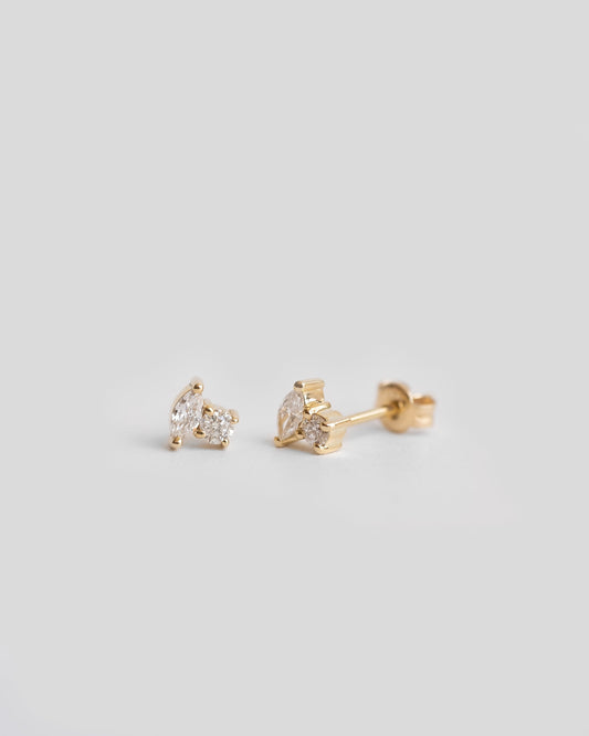 pair of gold stud earrings with diamonds