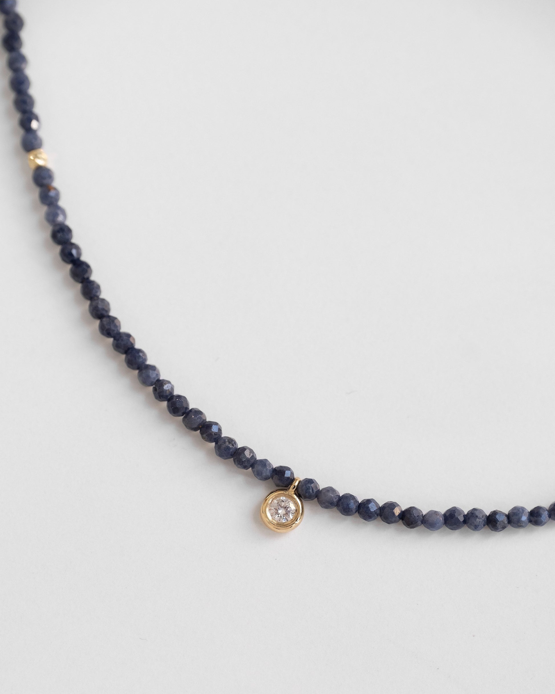 beaded sapphire gold necklace with round diamond 