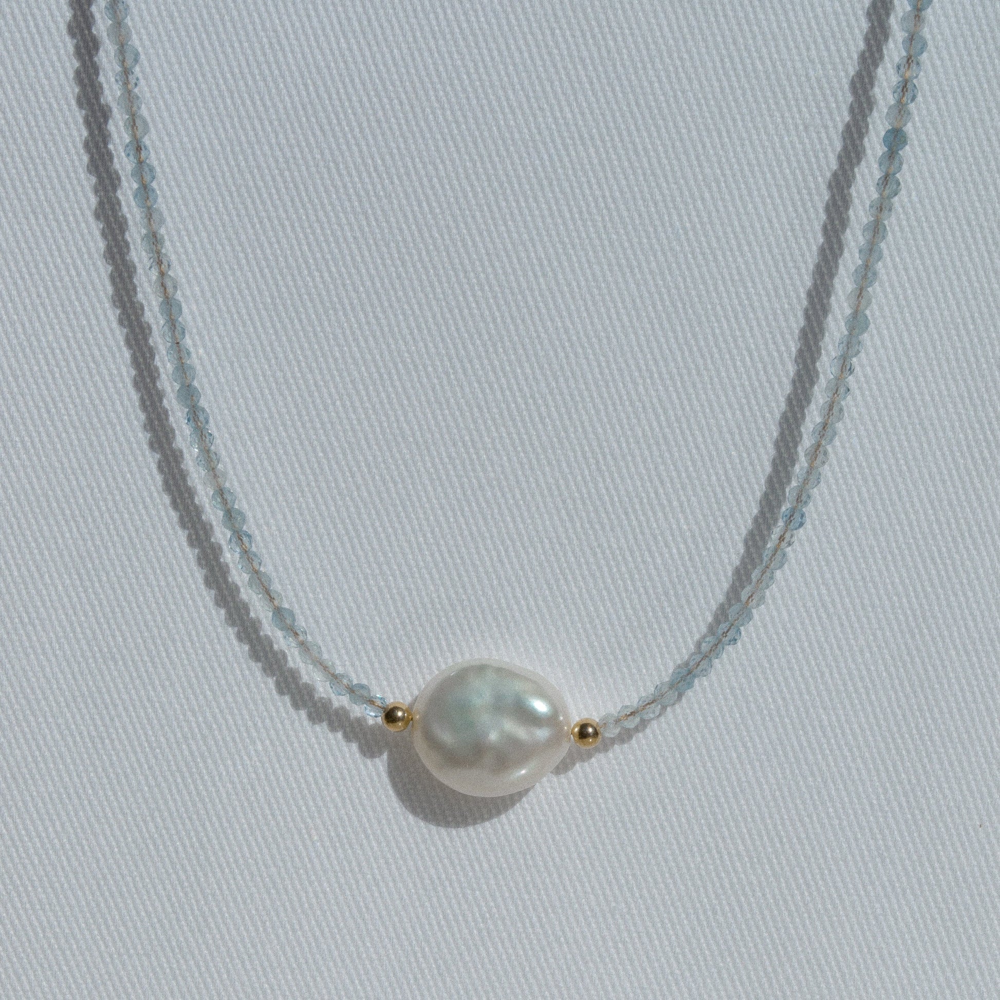 gold necklace with natural aquamarine stones baroque pearls and little gold balls 