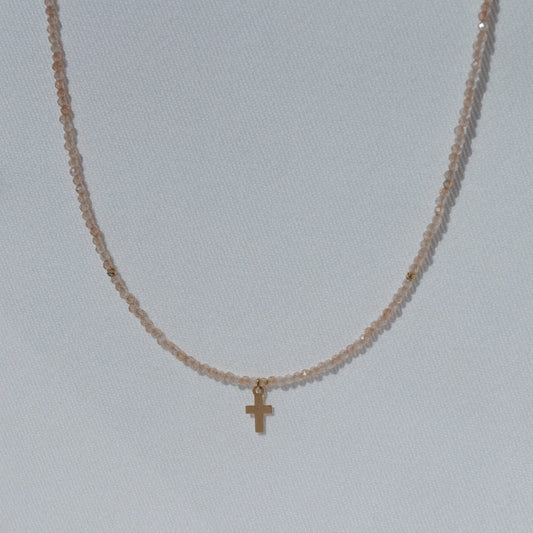 beaded necklace with zirconia stones and gold cross pendant 