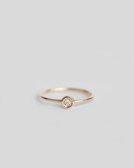 delicate gold ring with a single diamond