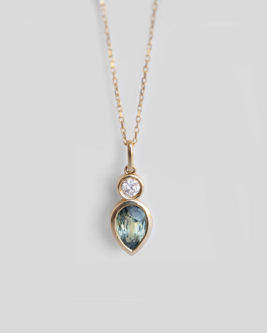 gold pendant necklace with blue green sapphire and round diamond, delicate gold necklace with bi color sapphire and round diamond