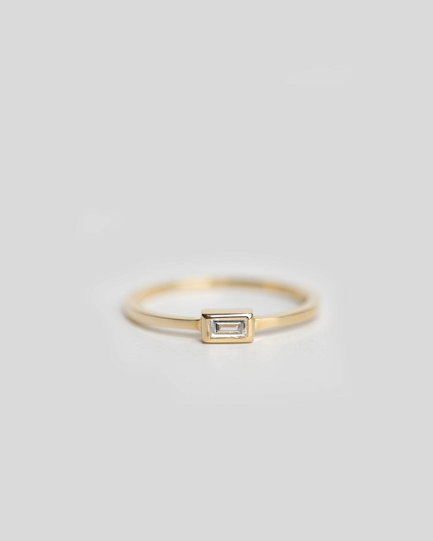 delicate gold solitaire diamond ring