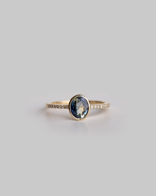 bi color sapphire ring with delicate diamond pave band 