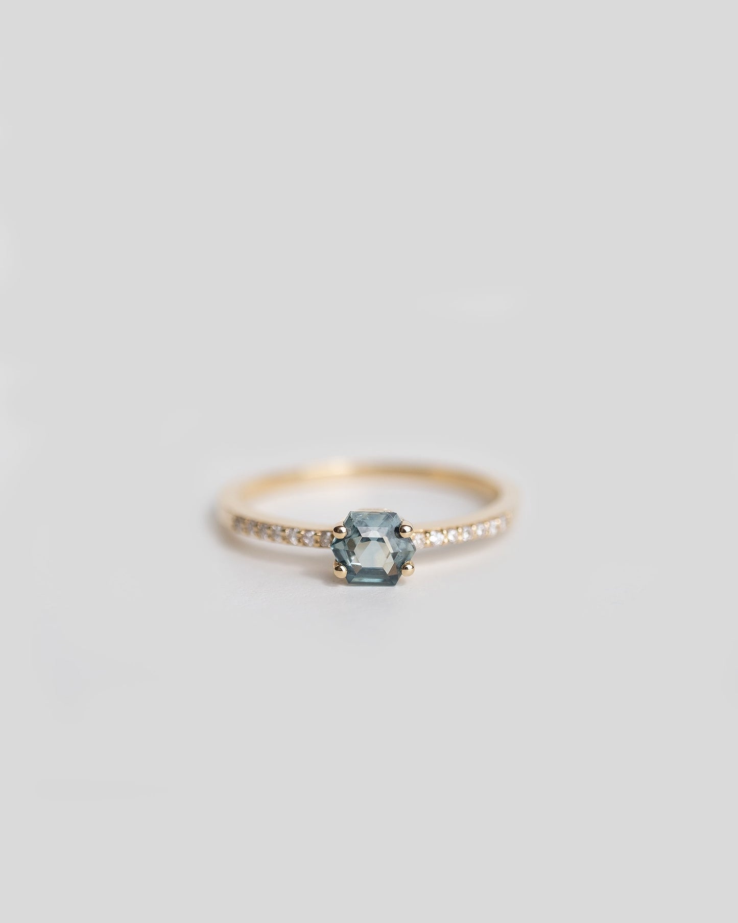 14k gold ring with teal sapphire and pave diamond band 