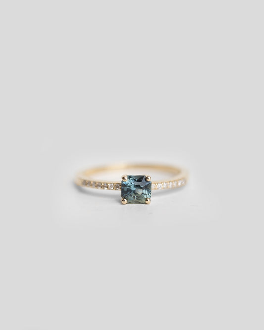 solitaire teal sapphire ring with pave diamond band