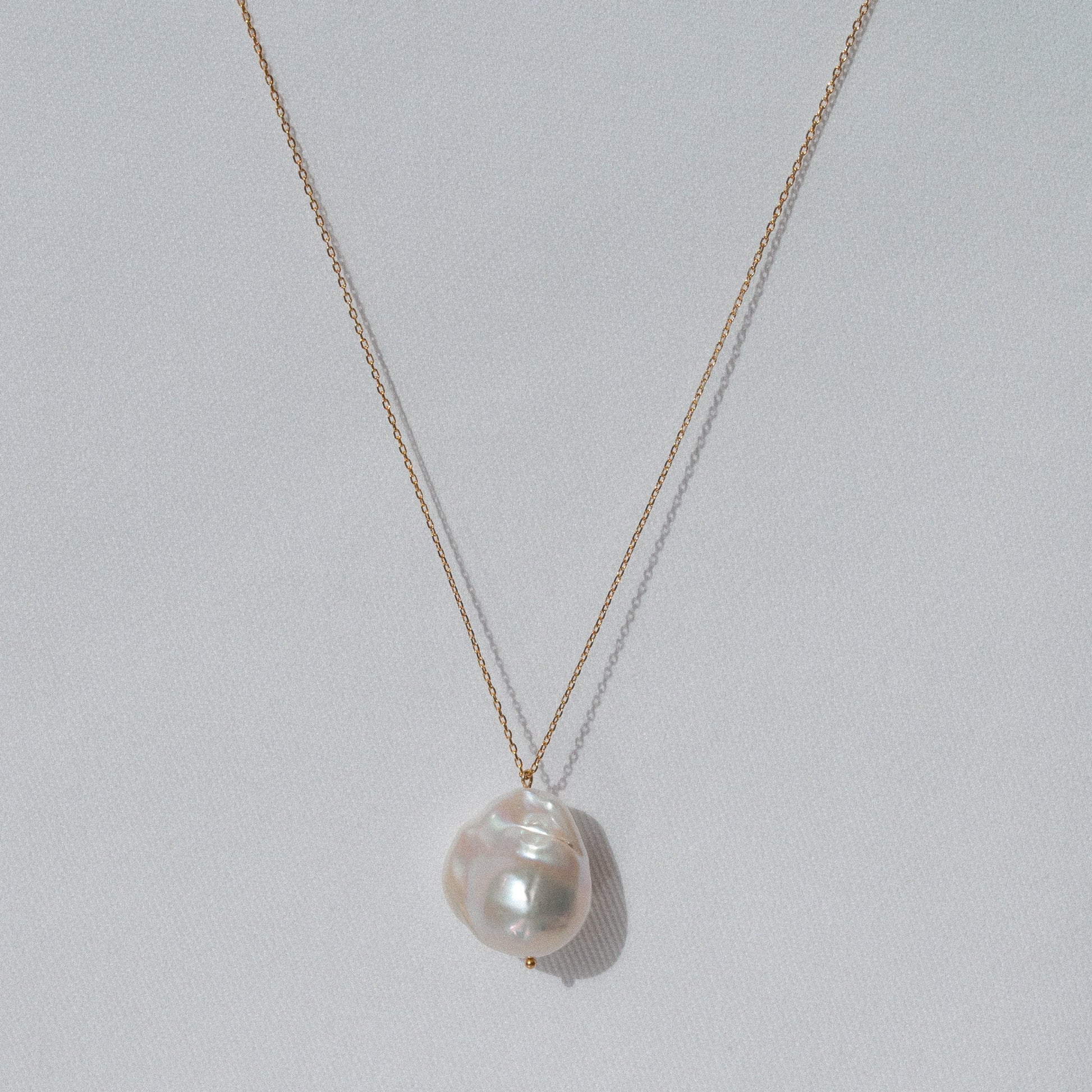 delicate gold pendant necklace with big natural baroque pearl 