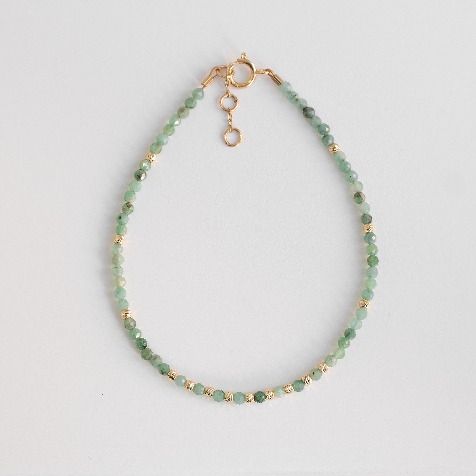 gold bracelet with delicate emerald beads 