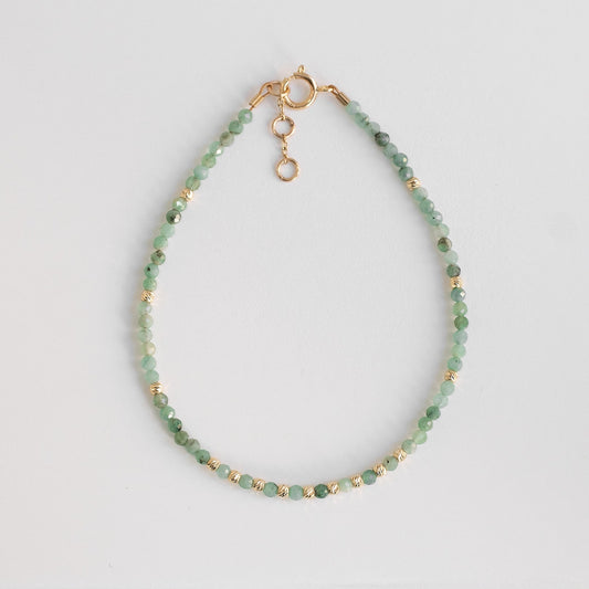 gold bracelet with delicate emerald beads